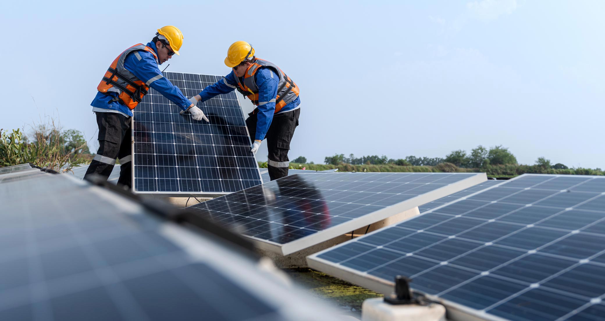 Workers installing solar panels